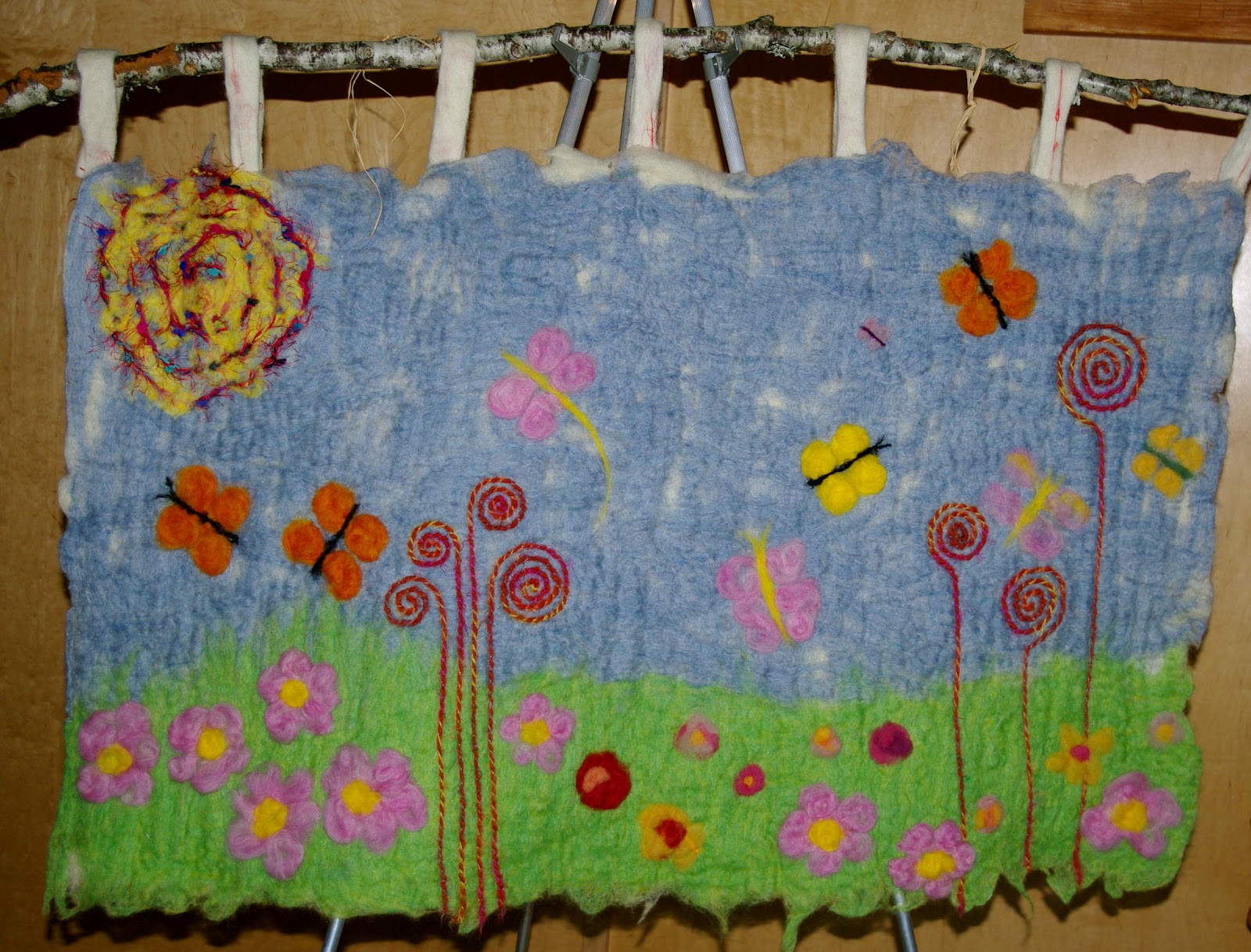 passengers on a little spaceship waldorf felted wall hanging