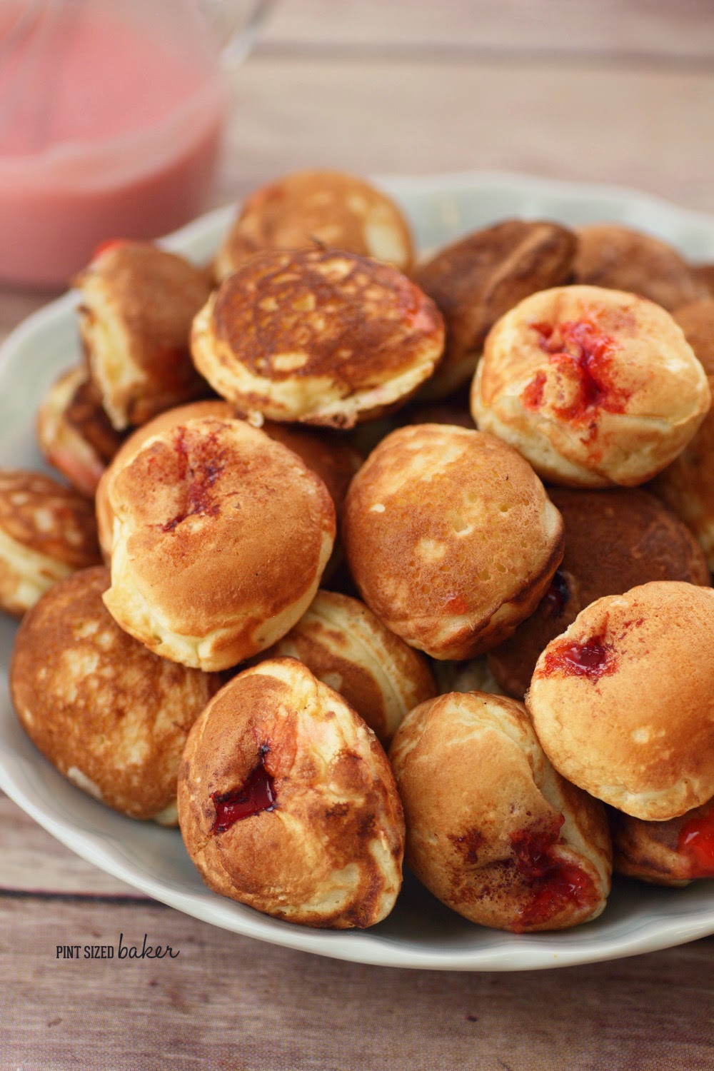 Mini Pancake Puffs stuffed with a cherry center. It's a fun treat! enjoy some Aebleskiver for dessert!