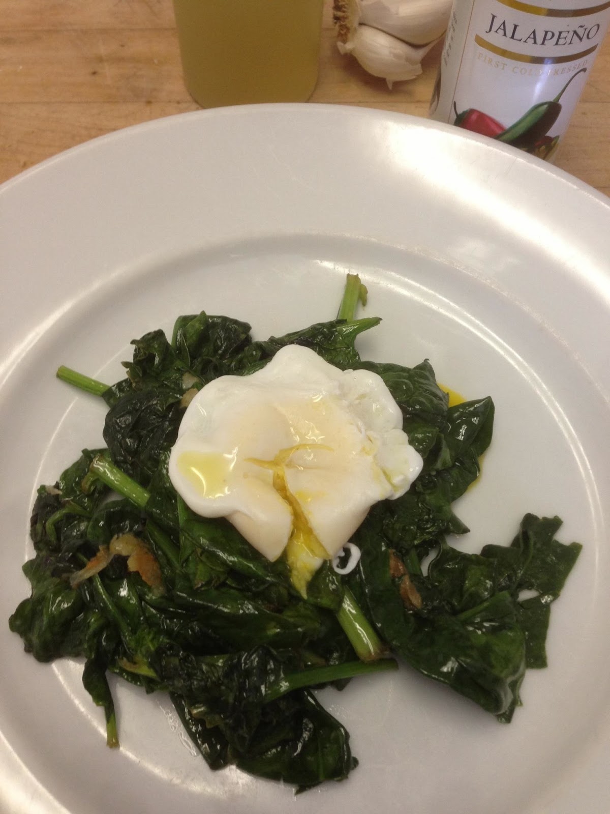 37 Cooks Poached Egg atop Jalapeño Spinach with Garlic