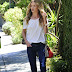 Rosie Huntington-Whiteley channels her inner hippie with ethereal crimped hair and her long limbs dressed in bell bottom jeans