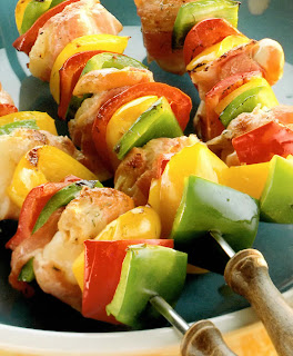 Bacon and Scallop Skewers: Classic barbecue dish of marinated scallops wrapped in bacon and barbecued on skewers with mixed bell peppers