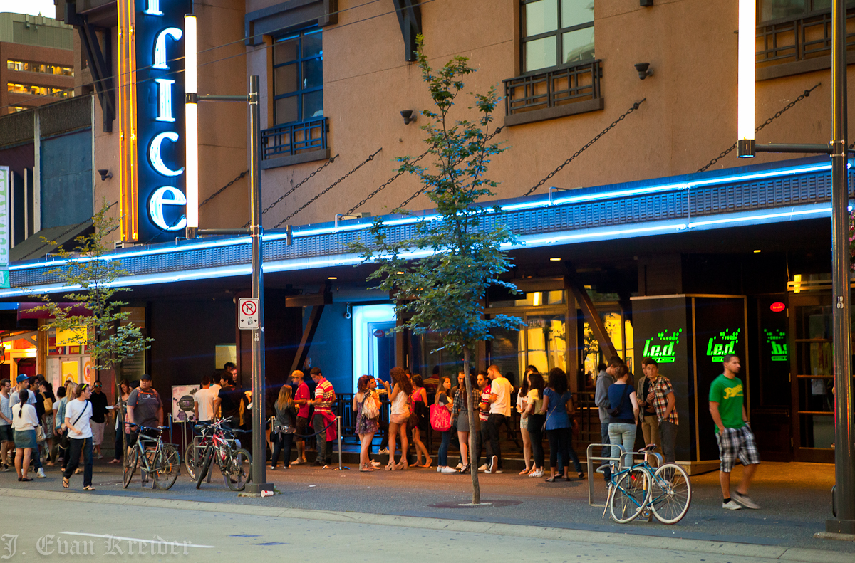 Kreider's Korner Photographs Store fronts at night on Granville Street