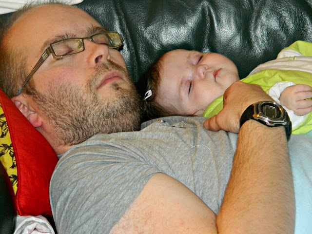 Baby girl daddy asleep together cuddles