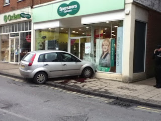 car crashed into opticians shop funny fail