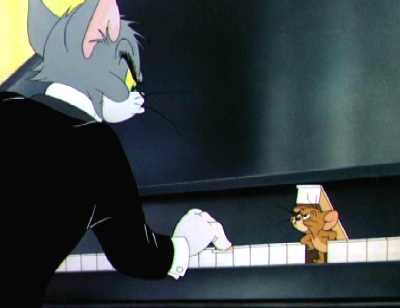 cartoon frame of Tom and Jerry at the piano keyboard