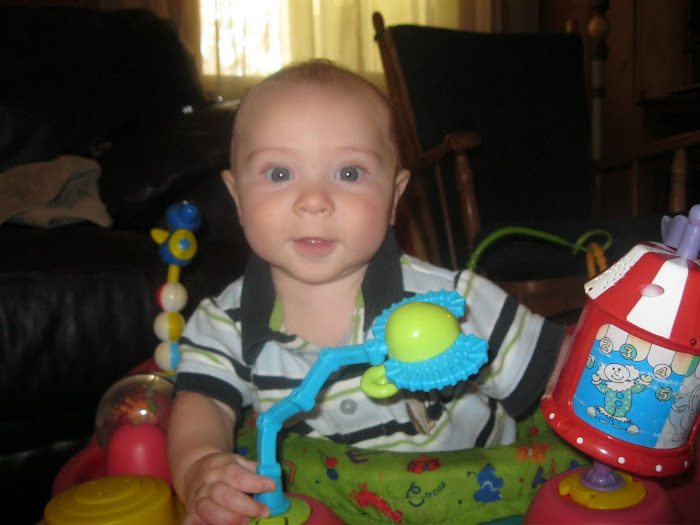 Micah in His Activity Saucer 5 months