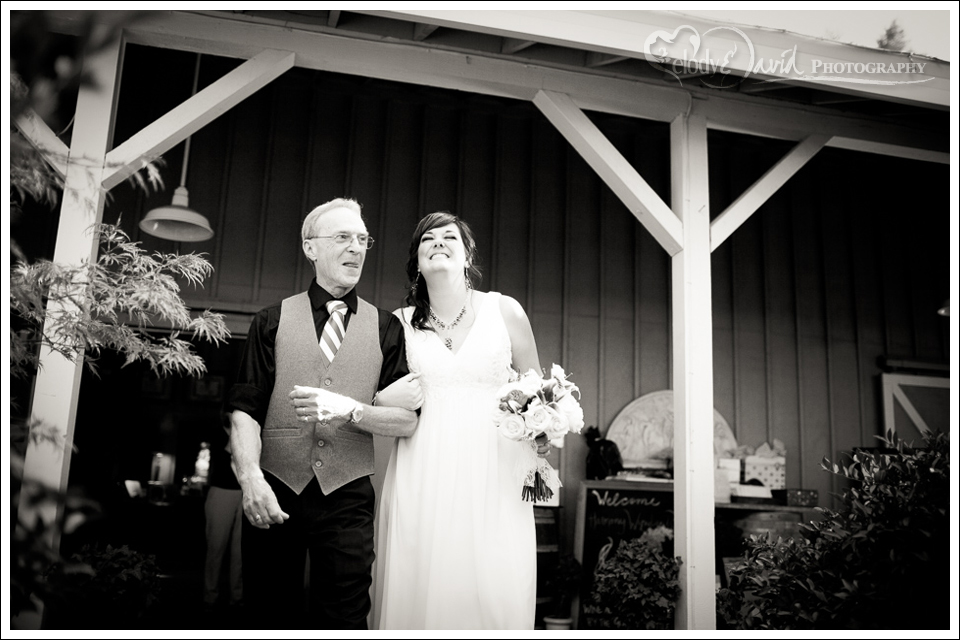 All smiles Father and Bride head down the aisle at Harmony Wynelands