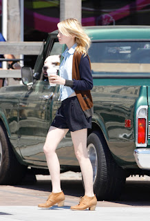 Emma Stone carrying coffee