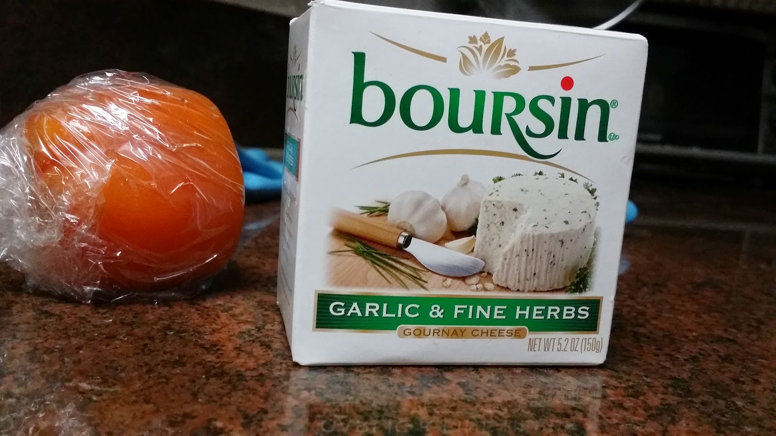 CRACKERS WITH GARLIC & HERB GOURNAY CHEESE TOPPED WITH TOMATOES AND