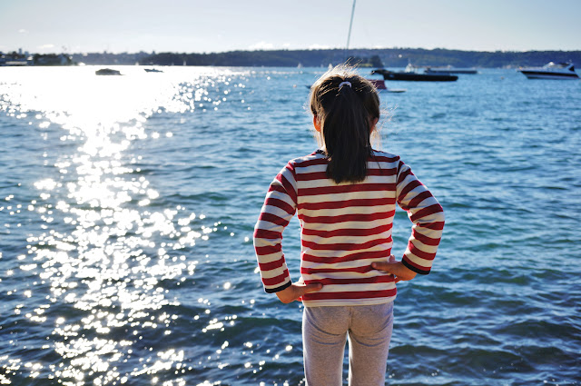 Photo of a child in Lyne Park, Rose Bay looking over the water.