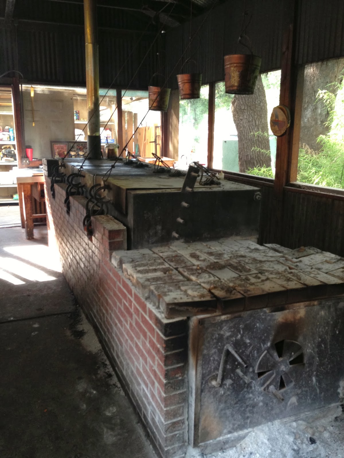 Man Up Tales of Texas BBQ™ The pit at Two Bros. BBQ Market (San