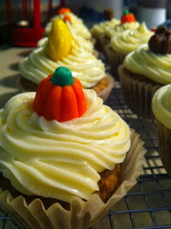  pumpkin cupcakes with cream cheese frosting