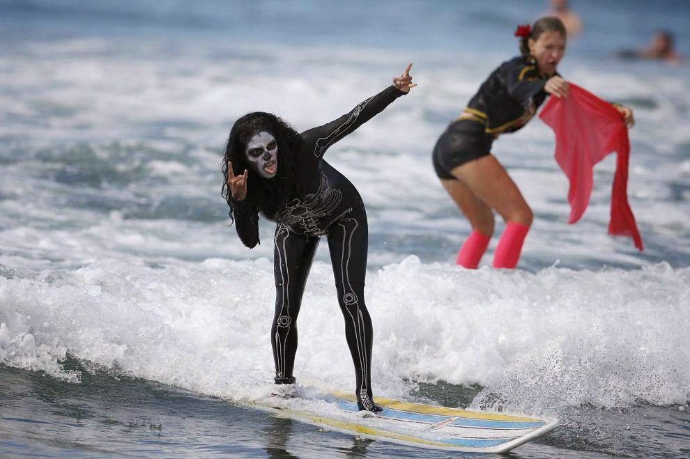 Halloween Surf Contest 2014 A competitor rides a wave during the 7th annual ZJ Boarding House Haunted Heats Halloween surf contest. (REUTERS/Lucy Nicholson)