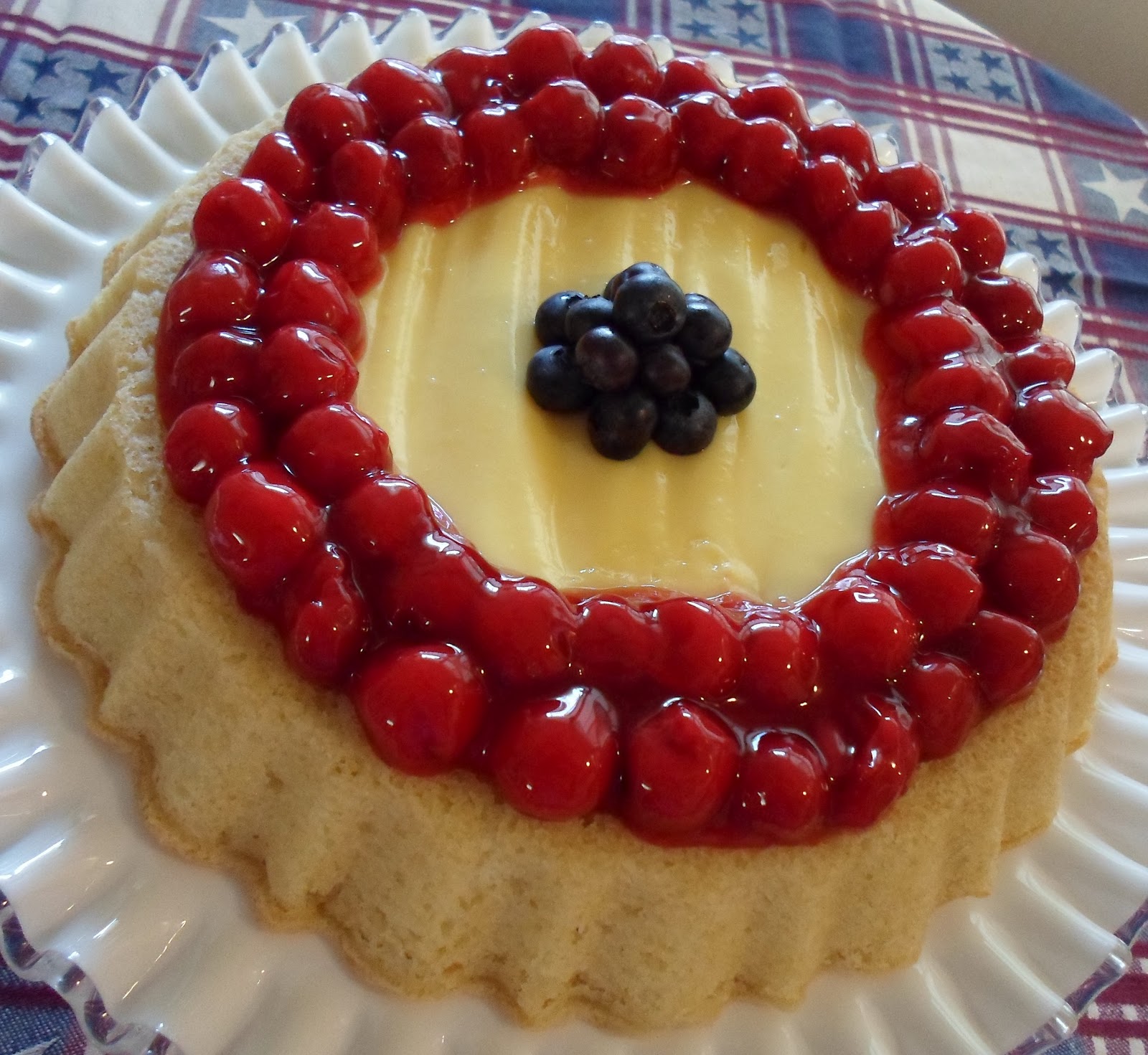 Happier Than A Pig In Mud Cherry Red, Whiteish and Blueberry Tiara Cake