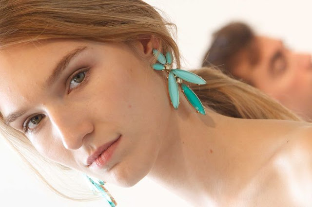 model with statement earrings