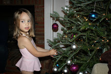 Decorating the tree in a bathing suit