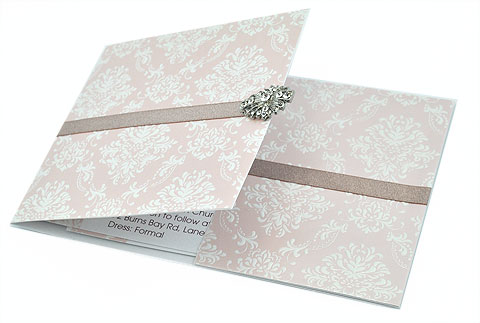 Or choose a fancier invite like this light pink damask invite with a brooch