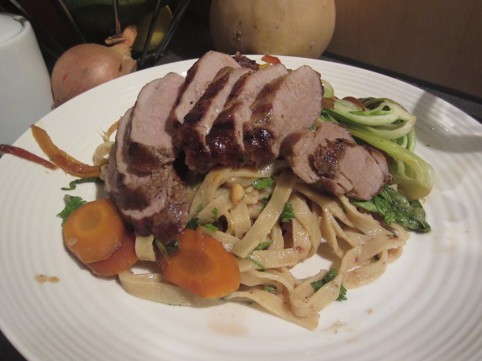 Busy Eating Satay Noodles With Grilled Pork Loin