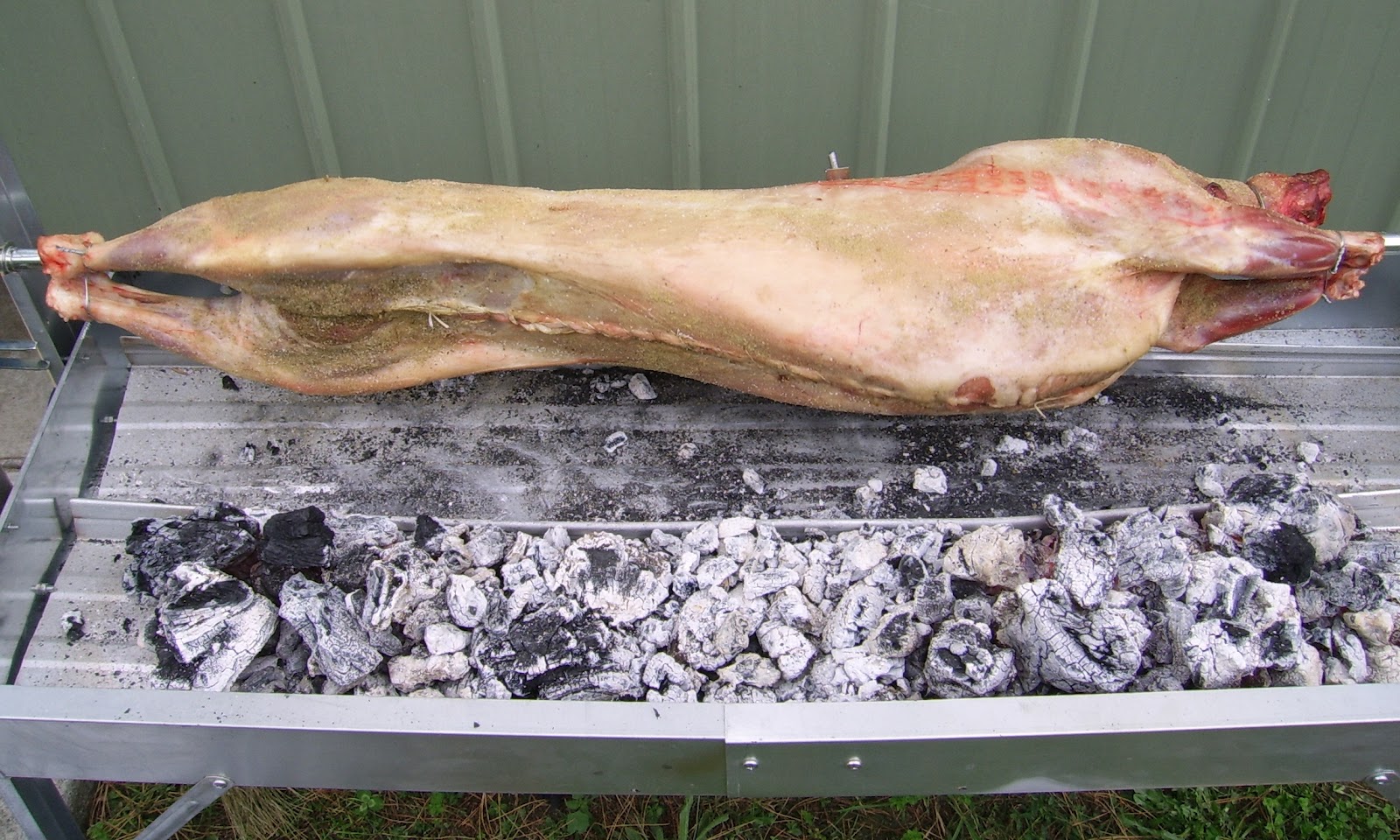 Outdoor cooking with charcoal How to spit roast a lamb