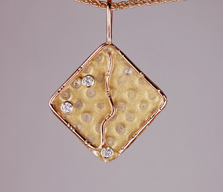 diamond shaped pendant in different colors of gold with diamonds