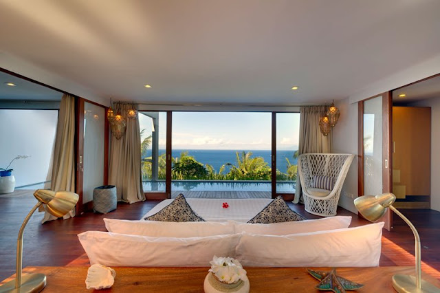 Picture of the ocean view from the bedroom, as seen from behind the bed
