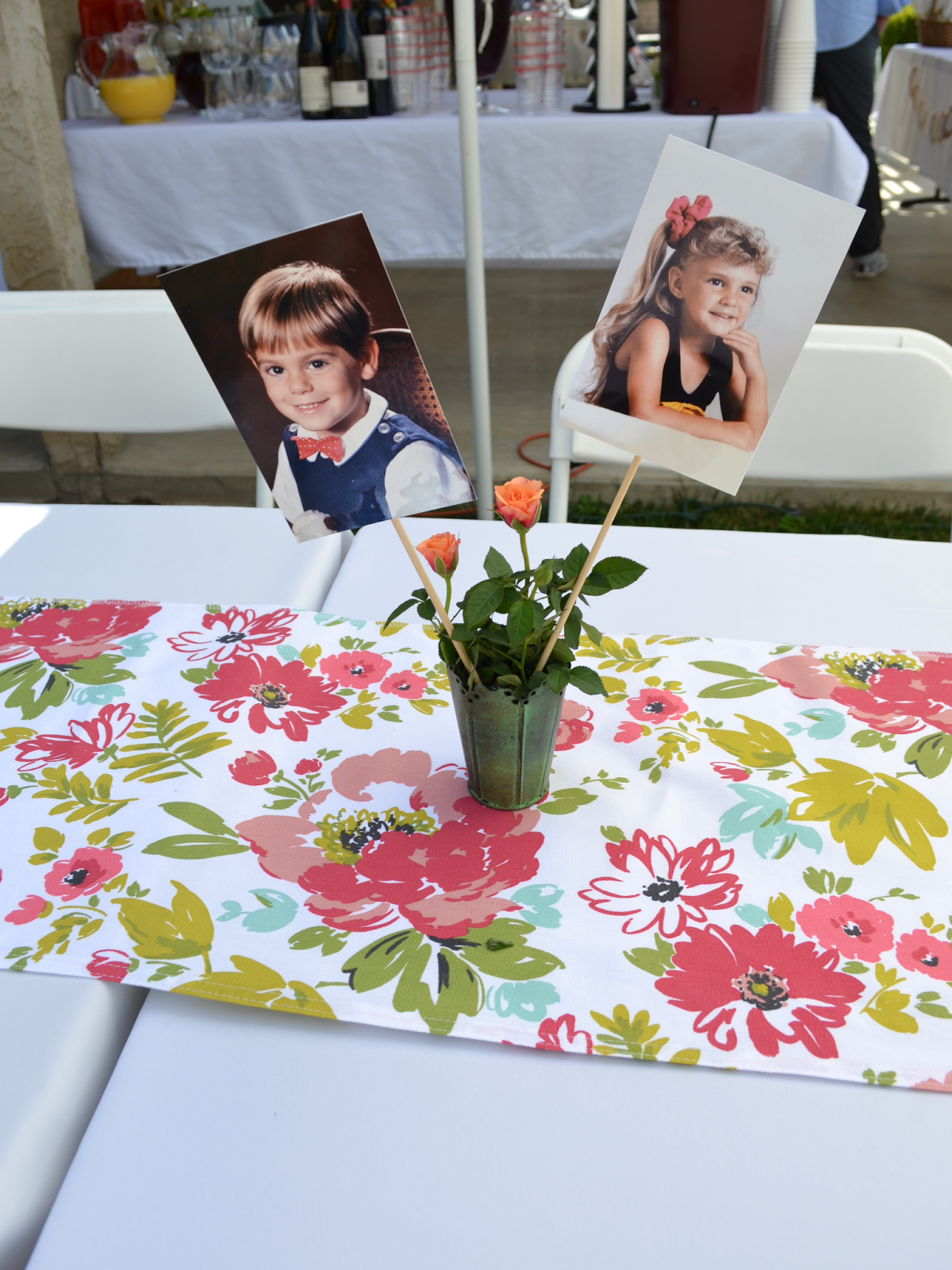 Engagement party champagne brunch table setting childhood photos