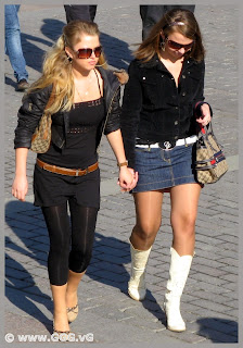 Girls in high heels boots on the street