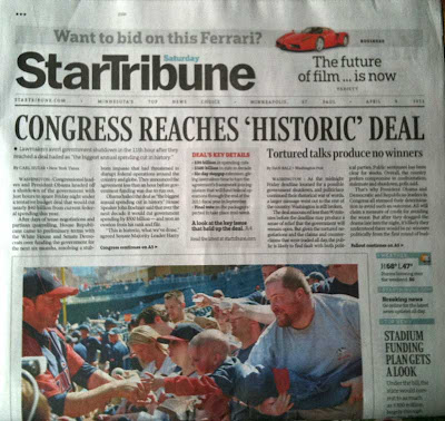 Front page of Star Tribune with photo of young boy reaching toward baseball player