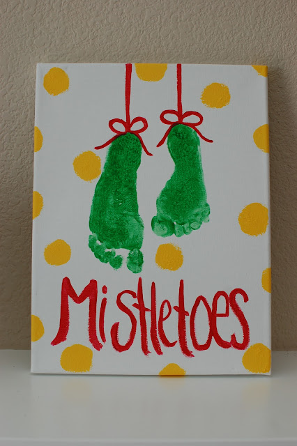alt="baby feet Christmas mistletoes wall art"