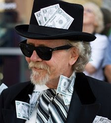 Man with cash stuffed in suit, hat