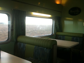 a table and chairs in a train