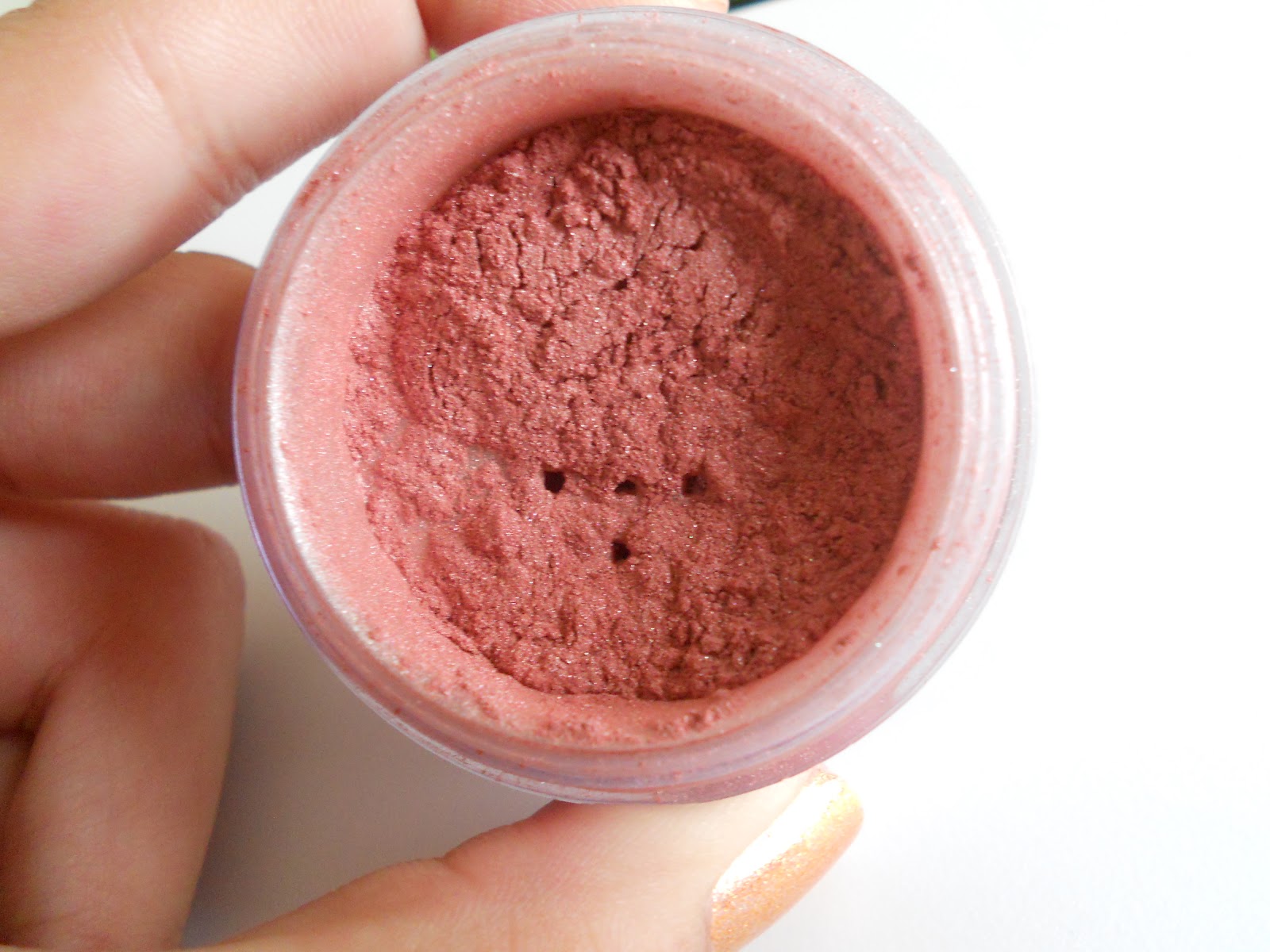 The Powder Room Cheek Chic Bare Minerals blush in "Hint"