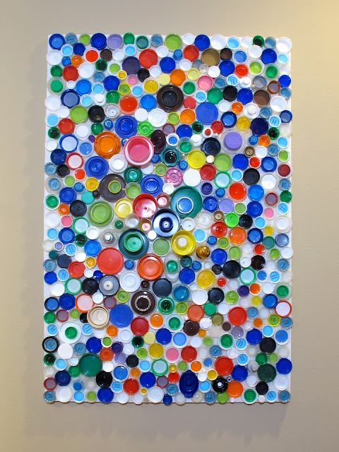 upcycled plastic bottle cap wall art