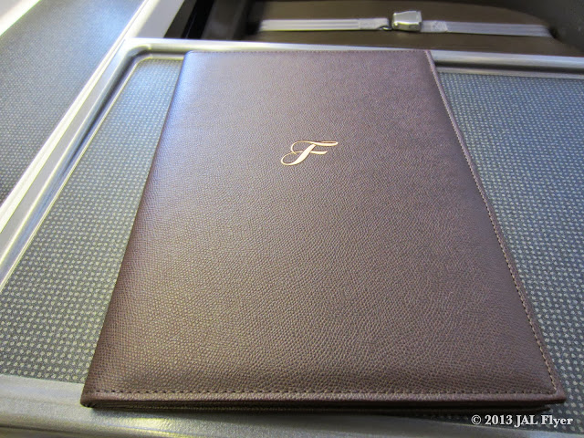 JAL uses a leather portfolio binder to hold menus, immigration forms and a thank you note.