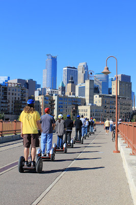 segway riders on the stone arch bridge