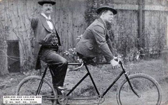 Charles+B.+Tripp,+the+armless+man+and+Eli+Bowen,+the+legless+man,+riding+a+tandem.+1890s.jpg