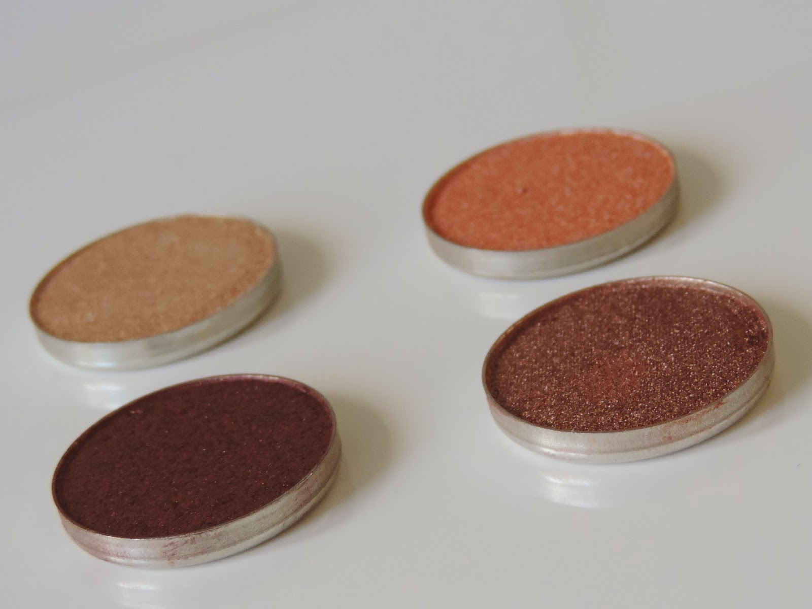 Makeup Geek Foiled Eyeshadows (clockwise) In The Spotlight, Grandstand, Showtime, Magic Act