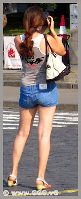 Girl in denim shorts on the street