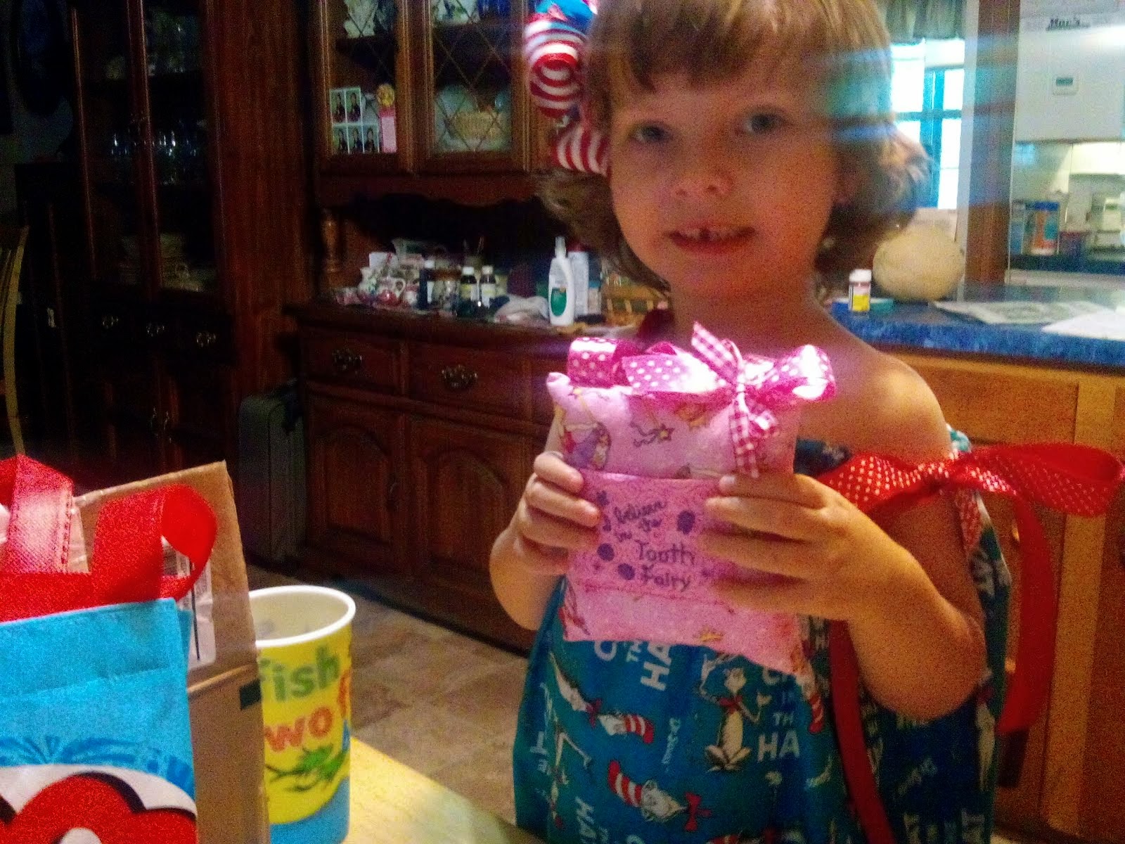 Her new dress and tooth fairy pillow