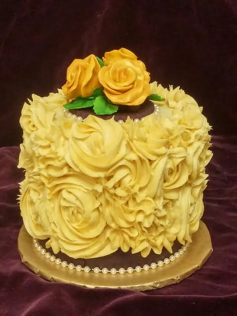 Gold Rose Swirl cake with rich purple detail.
