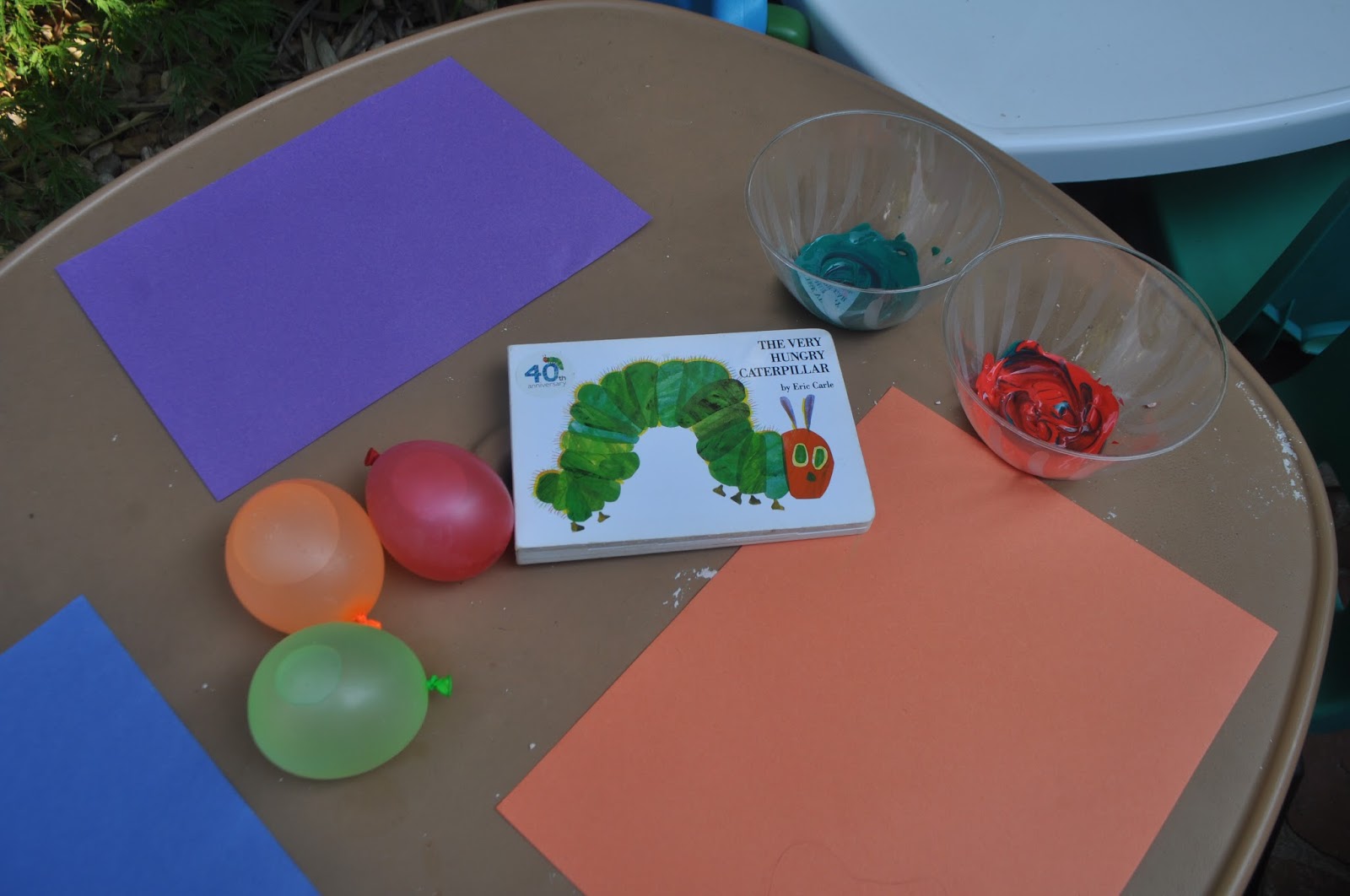 Minding Monkeys Painting A Caterpillar From Water Balloons