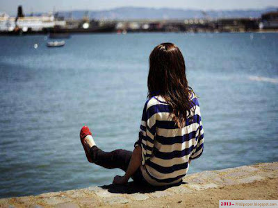beautiful-alone-girl-sitting-on-sea-beach-alone-hot