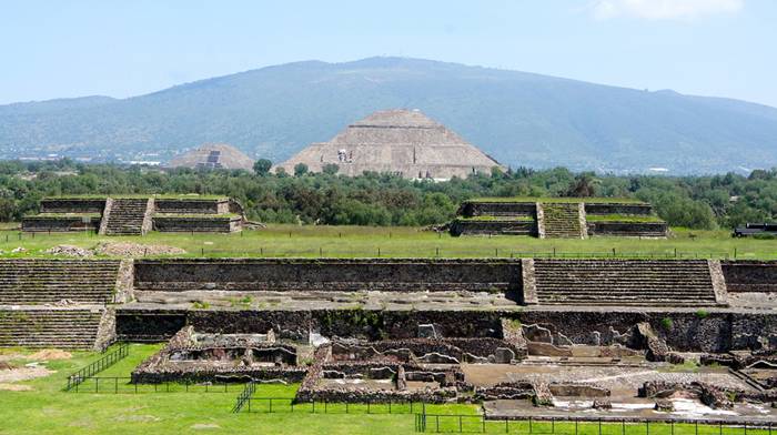 Pyramid of the Sun, It was massive, one of the first great cities of the Western Hemisphere. And its origins are a mystery. It was built by hand more than a thousand years before the swooping arrival of the Nahuatl-speaking Aztec in central Mexico. But it was the Aztec, descending on the abandoned site, no doubt falling awestruck by what they saw, who gave it a name: Teotihuacan. A famed archaeological site located fewer than 30 miles (50 kilometers) from Mexico City, Teotihuacan reached its zenith between 100 B.C. and A.D. 650. It covered 8 square miles (21 square kilometers) and supported a population of a hundred thousand, according to George Cowgill, an archaeologist at Arizona State University and a National Geographic Society grantee.