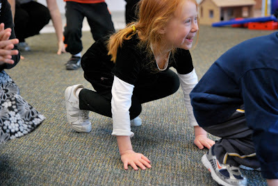 Photo of:  Now let's come up to standing while counting backwards, like a rocket taking off!
