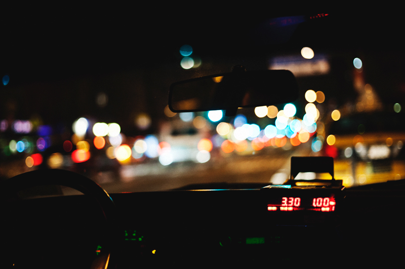 Blurred streetlights from inside a New York city cab