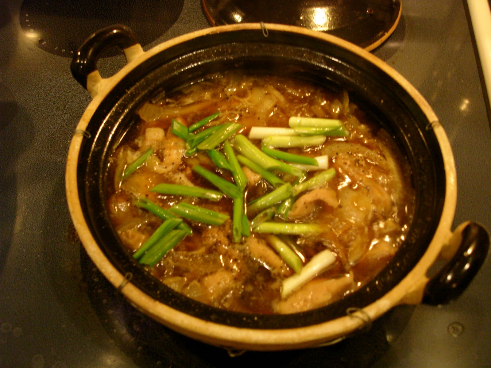 Cleaver Chops Vietnamese pork in a clay pot