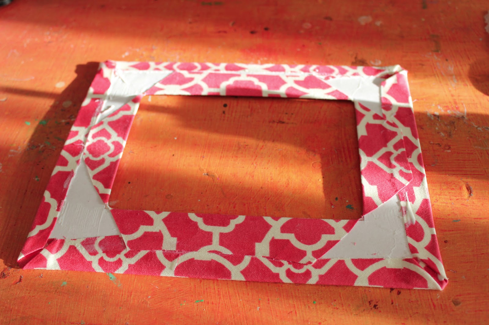 Cathie Filian DIY How to cover a photo mat with fabric and Mod Podge.