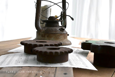 rusty gears, lantern and sheet music