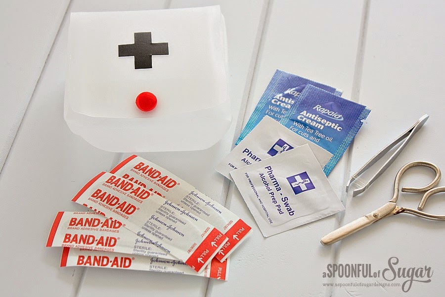 http://aspoonfulofsugardesigns.com/2014/06/first-aid-kit-from-a-recycled-milk-jug/