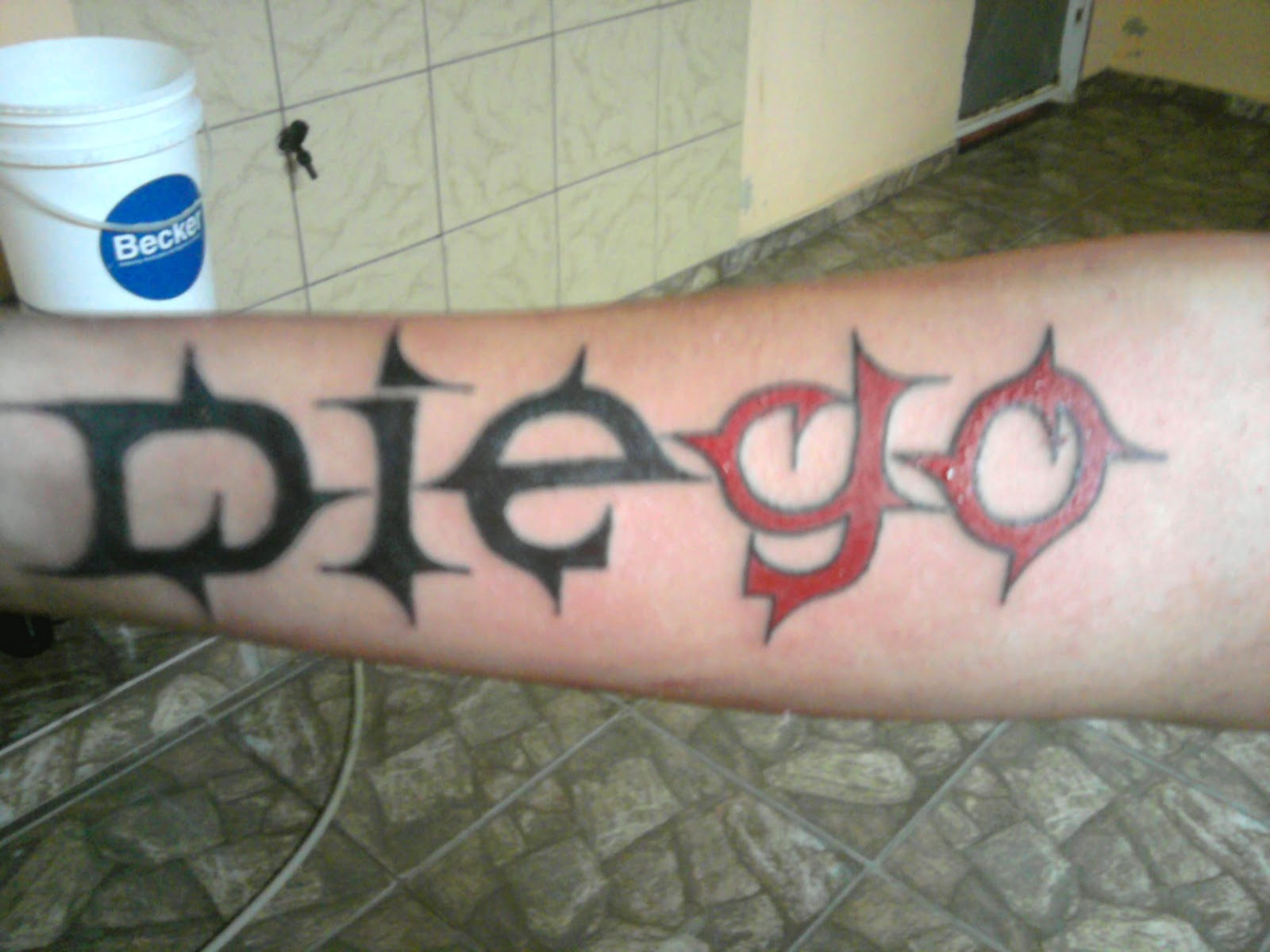 Heimdall Tattoo Nome no braço.